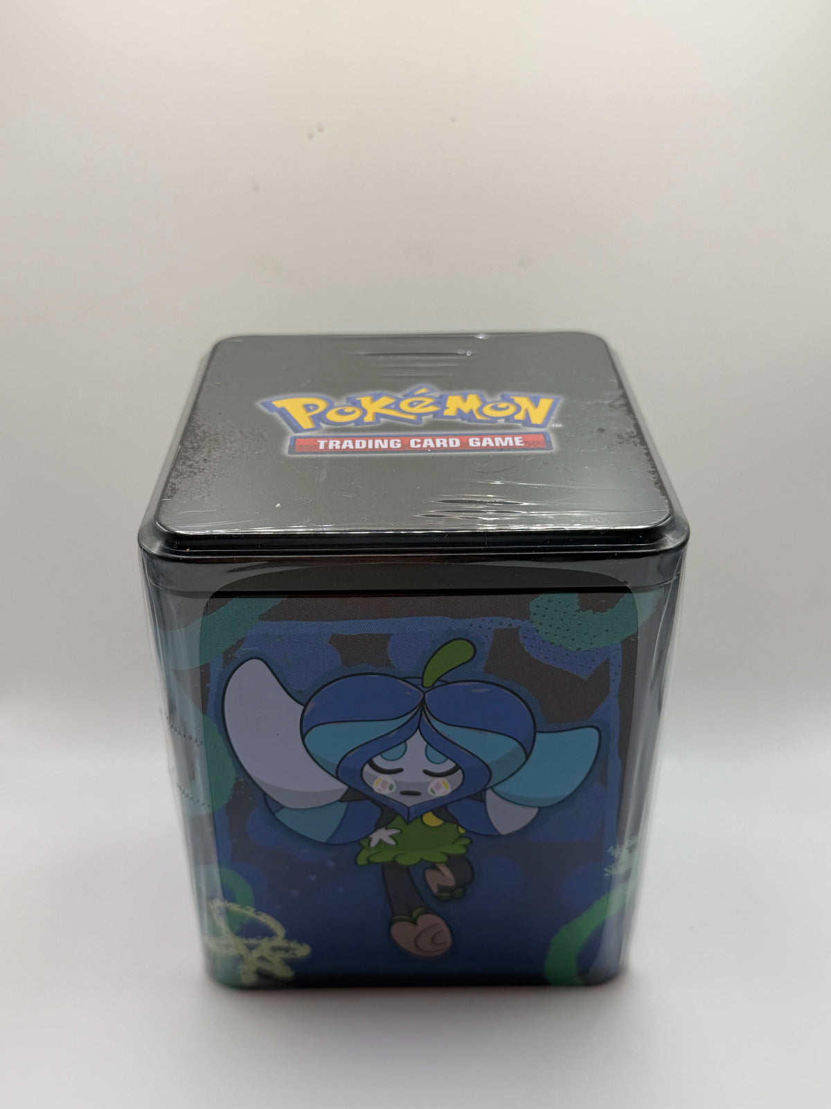 Pokémon TCG: Stacking Tin - Ogerpon / Wellspring Mask (Lata Apilable)